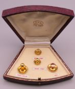 A set of 9 ct gold gentlemen's dress studs, housed in a fitted leather box. 3.2 grammes.
