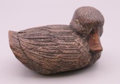 A Japanese carved model of a duck. 8.5 cm long.