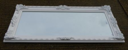 A large white framed mirror. 84.5 x 171 cm.