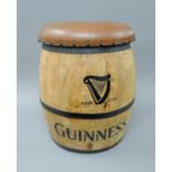A leather top Guinness barrel stool. 52 cm high.