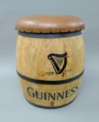 A leather top Guinness barrel stool. 52 cm high.