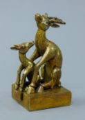 A gilt bronze double deer seal. 12 cm high.