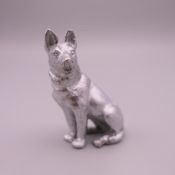 A miniature figure of an Alsatian/German Shepherd dog. 6 cm high.