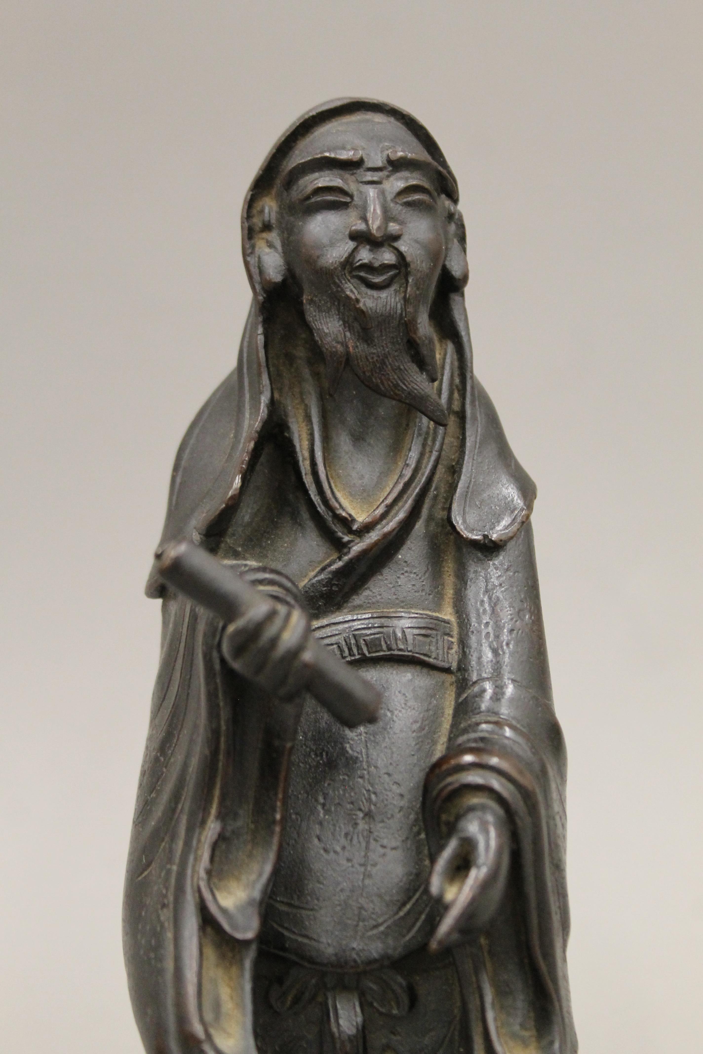 A pair of Chinese bronze models of sages. The largest 25 cm high. - Image 3 of 11