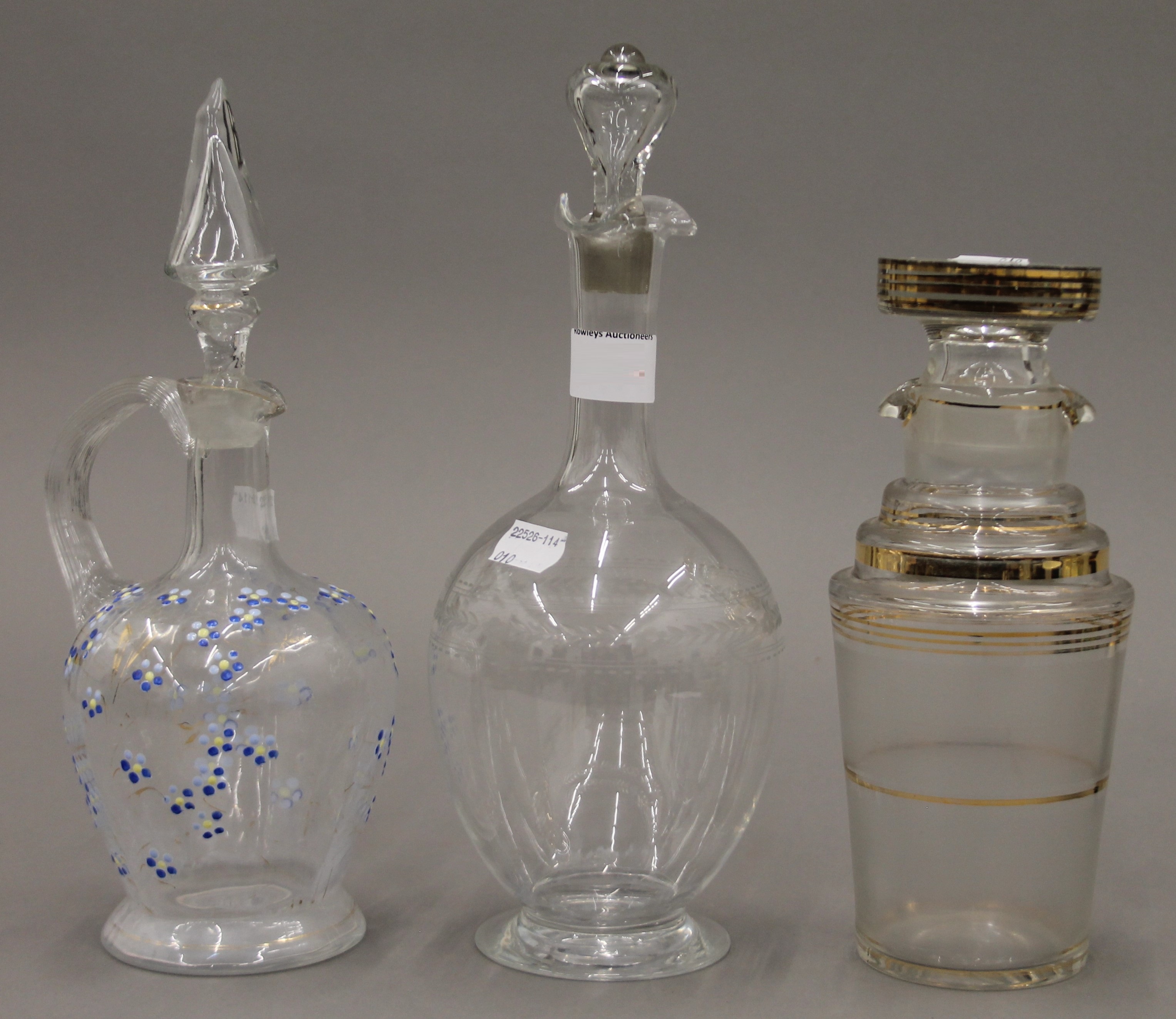 Three various glass decanters. The largest 30 cm high.