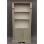 A modern white painted pine bookcase. 96.5 cm wide x 192 cm high.