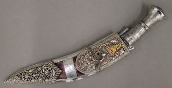 A kukri with ornate unmarked white metal scabbard (Kothimora),