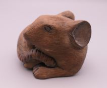 A Japanese carved wooden rat. 6 cm wide.