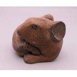 A Japanese carved wooden rat. 6 cm wide.