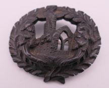 A Victorian bog oak brooch, inscribed Mucross to reverse possibly for Muckross Abbey. 5.5 x 4.