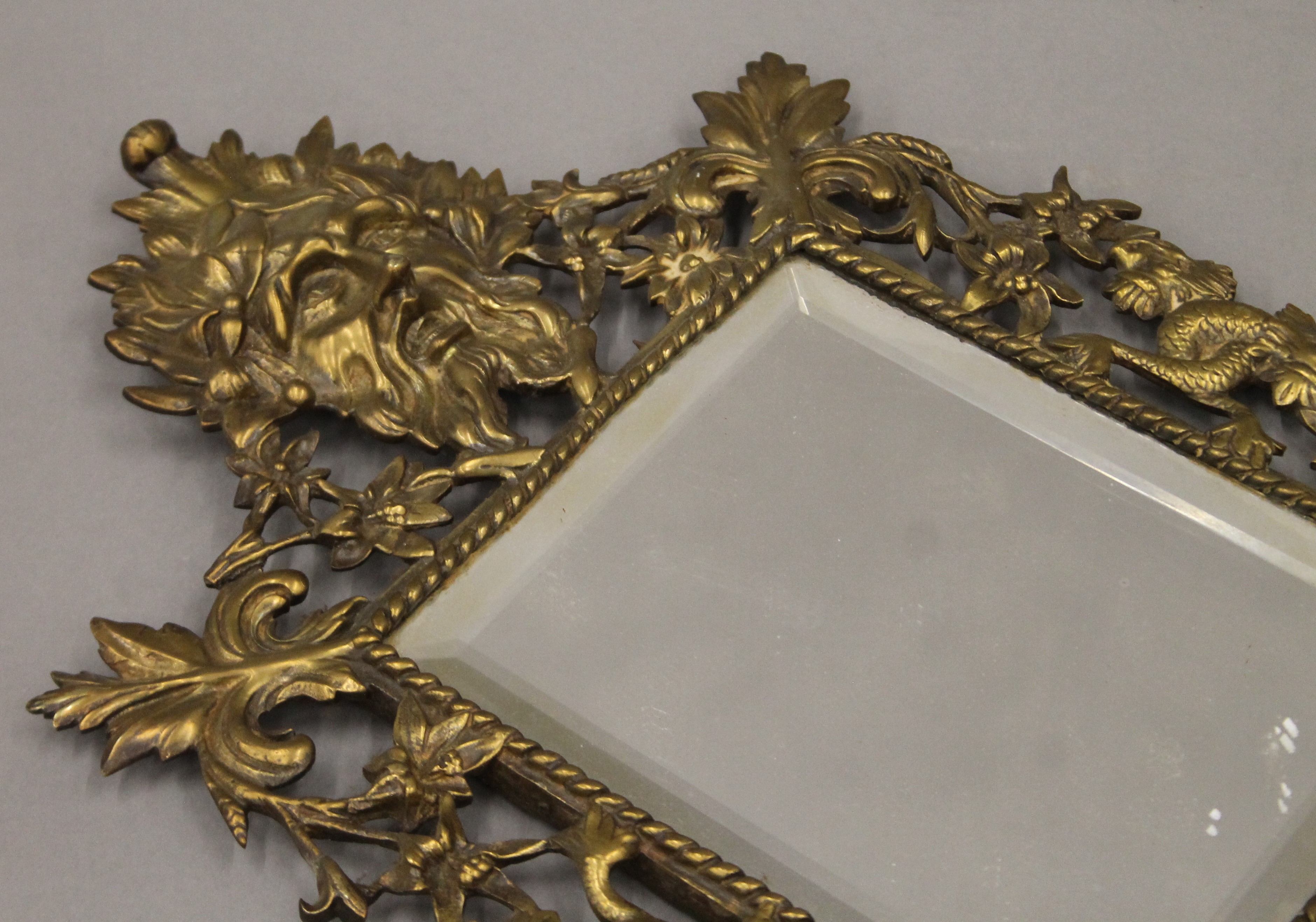 A brass framed mirror. 43 cm high. - Image 2 of 3
