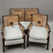 A three-piece bergere suite. The settee 120 cm wide.