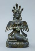 A Chinese bronze winged figure. 26 cm high.