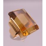 A French 18 ct gold emerald cut (approximately 55 carat) citrine ring. Ring size K/L.