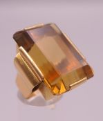 A French 18 ct gold emerald cut (approximately 55 carat) citrine ring. Ring size K/L.