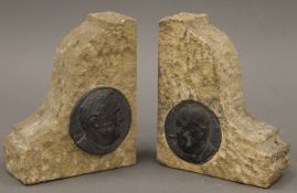 A pair of bookends made from stone from The Houses of Parliament, one depicting Churchill,