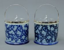 A pair of blue and white porcelain and silver plated biscuit barrels. 20 cm high overall.