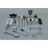 A box of miscellaneous items, including a watch, dressing table items,