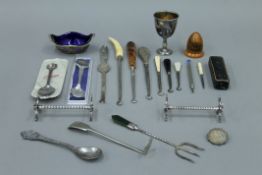 A box of miscellaneous items, including a watch, dressing table items,