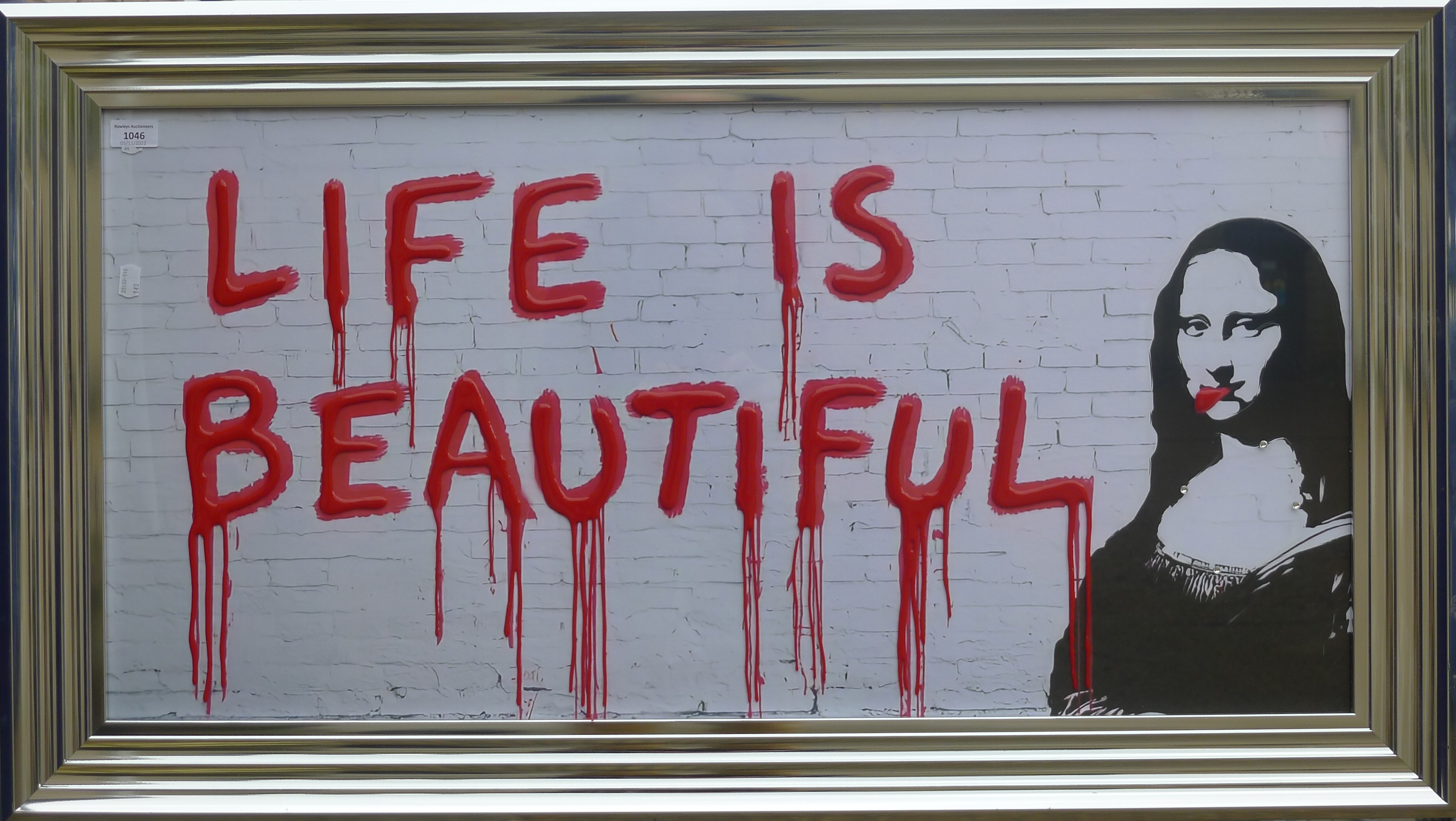 In the Style of Banksy, Life is Beautiful, framed and glazed. 98.5 x 48.5 cm.