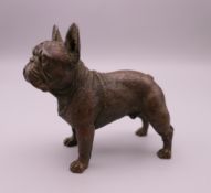 A bronze model of a French bulldog. 7.5 cm long, 7 cm high.