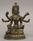 A small antique Tibetan six armed bronze figure of Buddha. 13.5 cm high.