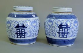 A pair of Chinese blue and white porcelain ginger jars. 23 cm high.