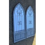 A pair of grey painted arched garden mirrors. 137 cm high.
