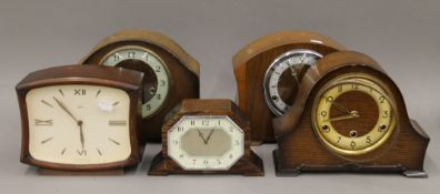 Five vintage mantle clocks.