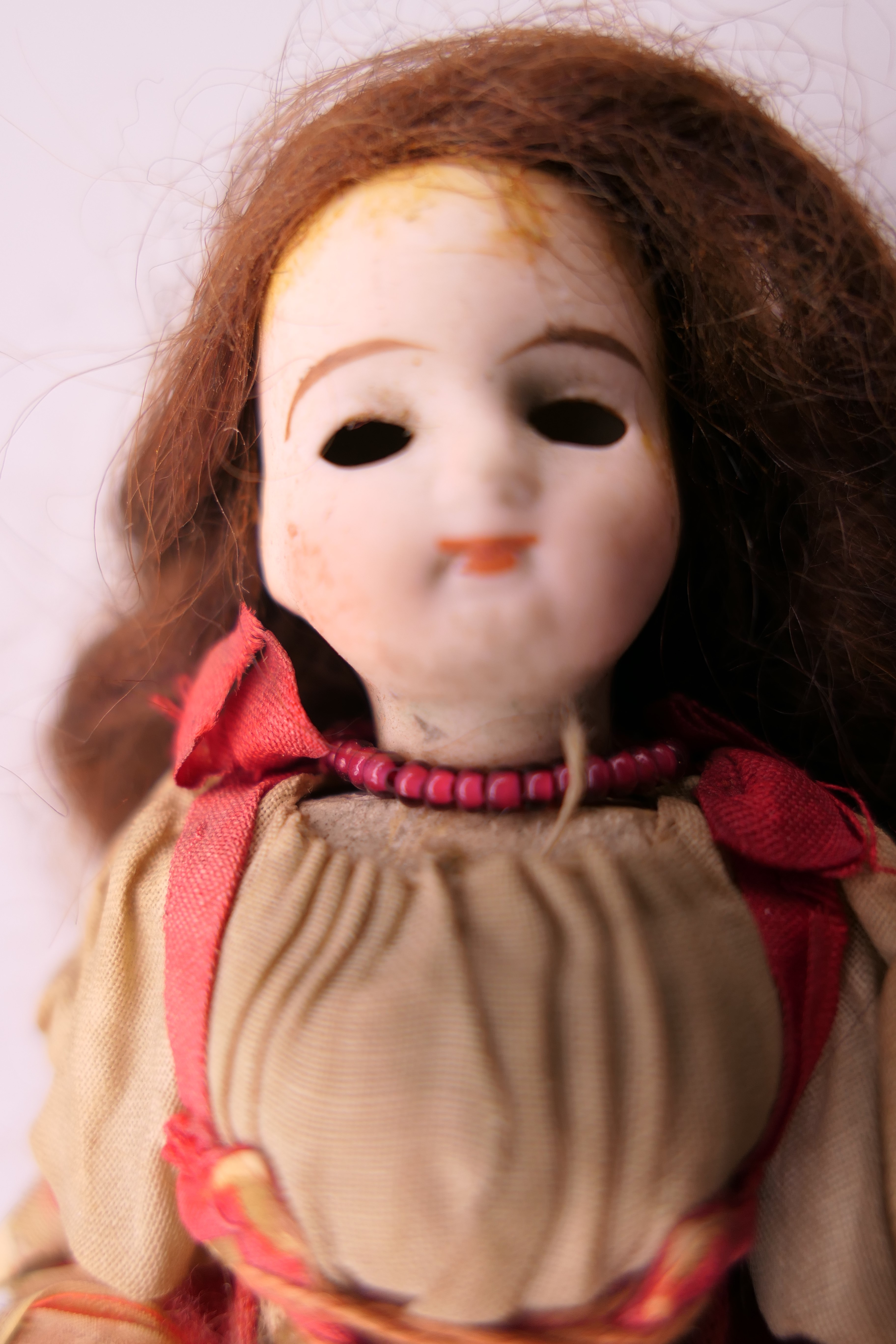 A 19th century miniature bisque headed doll. 13 cm high. - Image 3 of 9