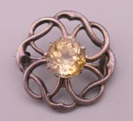 A Scottish silver citrine brooch. 2.75 cm diameter.