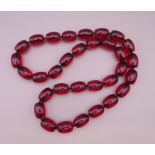 A large bead necklace. Approximately 86 cm long.