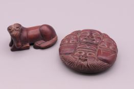 Two small carvings, one formed as a horse, the other faces. Horse 5 cm long, faces 5.5 cm diameter.