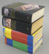 Four J K Rowling first edition Harry Potter books, with dust covers.