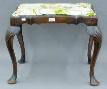 A 19th century mahogany stool. 61 cm wide.
