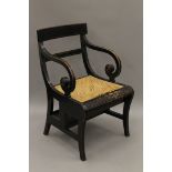 An ebonised metamorphic library chair. 55 cm wide.