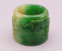 A carved jade archer's ring. 3.5 cm diameter, 3 cm high.