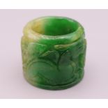 A carved jade archer's ring. 3.5 cm diameter, 3 cm high.