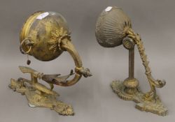 Two 19th century brass oil lamp wall sconces. The largest 35 cm high.