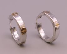 A pair of 9 ct white gold earrings. 2 cm diameter. 2.6 grammes.