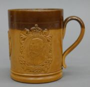 A Royal Doulton stoneware Coronation mug for King George V and Queen Mary. 9.5 cm high.