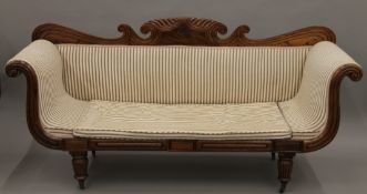 A 19th century upholstered mahogany settee. Approximately 198 cm wide.