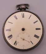 A silver pocket watch. 5.25 cm diameter.