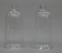 Two glass storm lamps shades.
