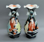 A pair of 19th century Japanese porcelain frilly edged vases. 36 cm high.