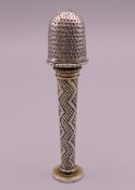 A 19th century unmarked white metal sewing companion/seal. 7.5 cm high.