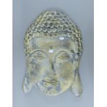 A rustic wall mounted buddha face. 57 cm high.