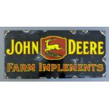 An enamel John Deere sign. 45 cm wide.
