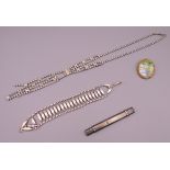 A silver bracelet, a silver pencil/letter opener, a brooch and a necklace. Bracelet 20 cm long.