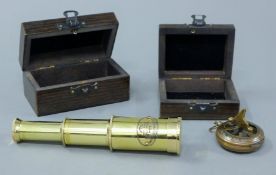 A boxed telescope and a compass.